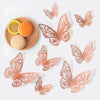 Rose gold 3D butterfly wall stickers with a butterfly and citrus fruit on a wooden surface