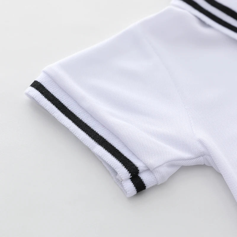 White polo shirt sleeve with black stripes and a matching short sleeve for a toddler set