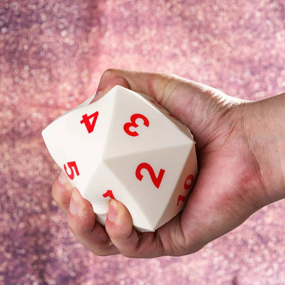 A hand holds a white D20 polyhedral dice with numbers 1 through 5, set against a blurred purple background.