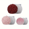 Two silicone molds shaped like rose flower balls in deep red and light pink are shown.