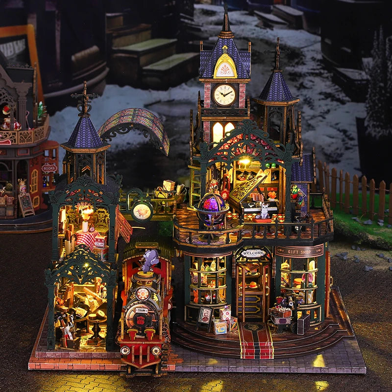 A detailed wooden miniature rail-track city dollhouse kit featuring various buildings and furniture.