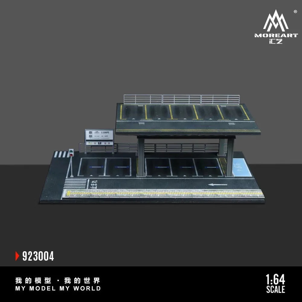 A 1:64 scale mini garage diorama featuring a black and gray structure for diecast cars.