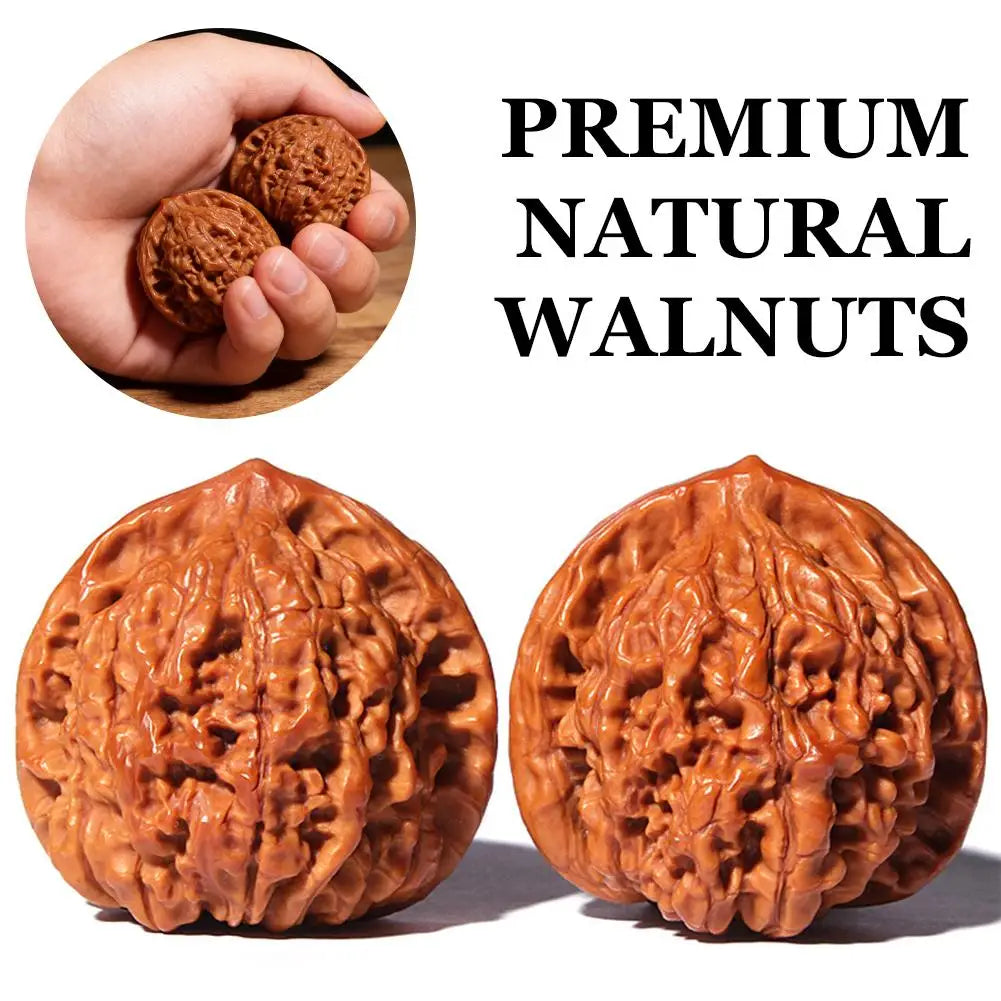 Two halves of premium natural walnuts showing the textured, brown shell.