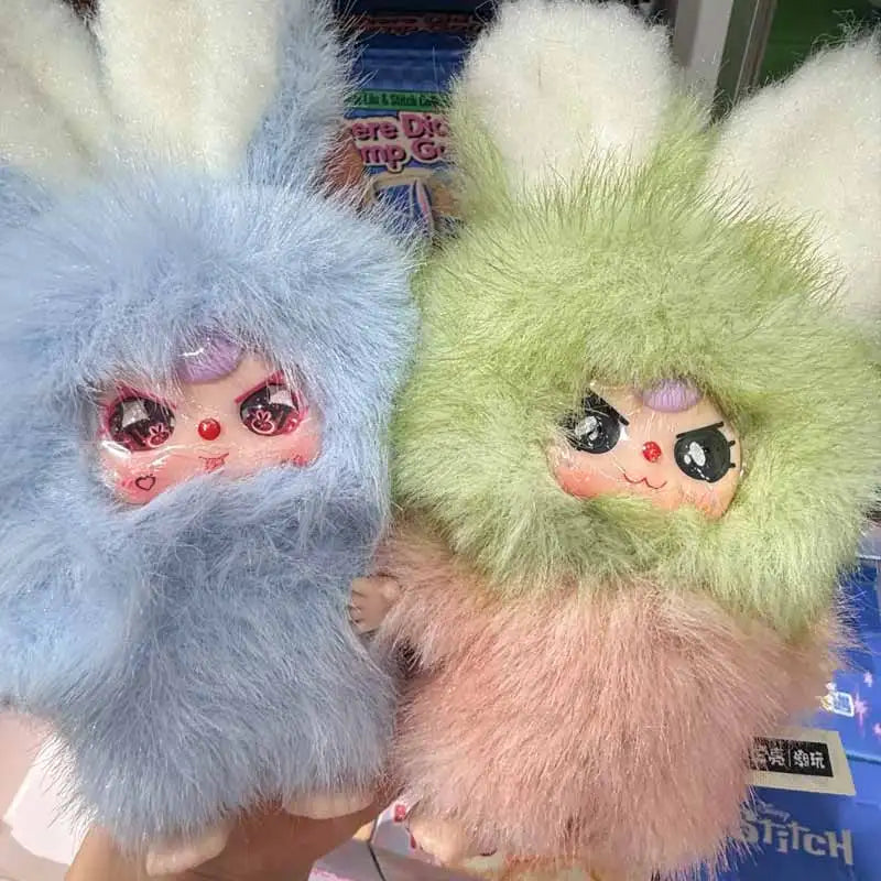 A pair of fluffy bunny-themed blind box collectibles featuring light blue and lime green fur.
