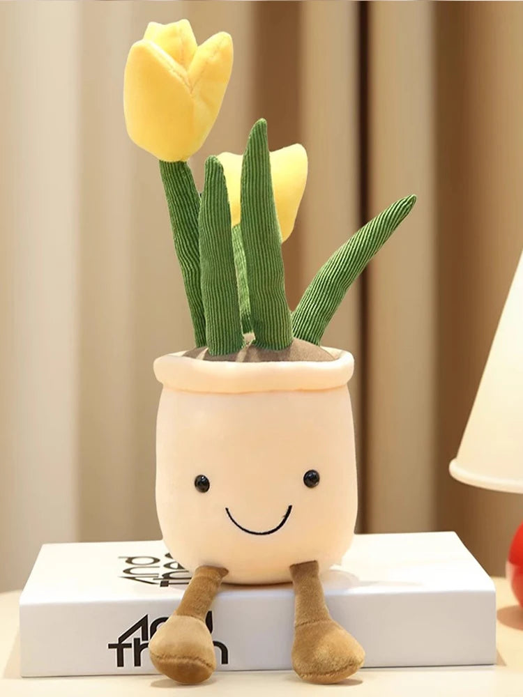 A cute plush toy resembling a tulip succulent plant with green leaves and yellow flowers growing out of a light-colored pot.