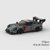 A gray classic rally car building block set with a black roof and wheels.