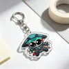 An acrylic keychain charm featuring an anime-inspired character with a mask and tactical gear.