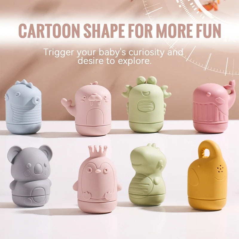A collection of cartoon-shaped silicone bath toys in various pastel colors, including elephant, dinosaur, and bear designs.