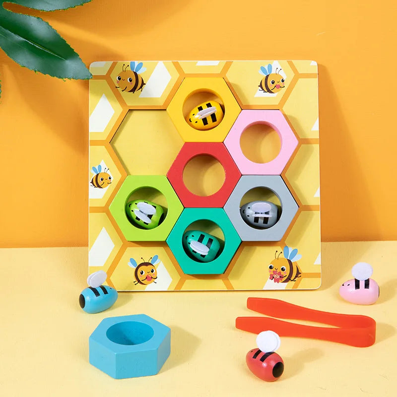 A wooden Montessori Bee Trap game featuring colorful hexagonal clips and a small wooden bee piece.