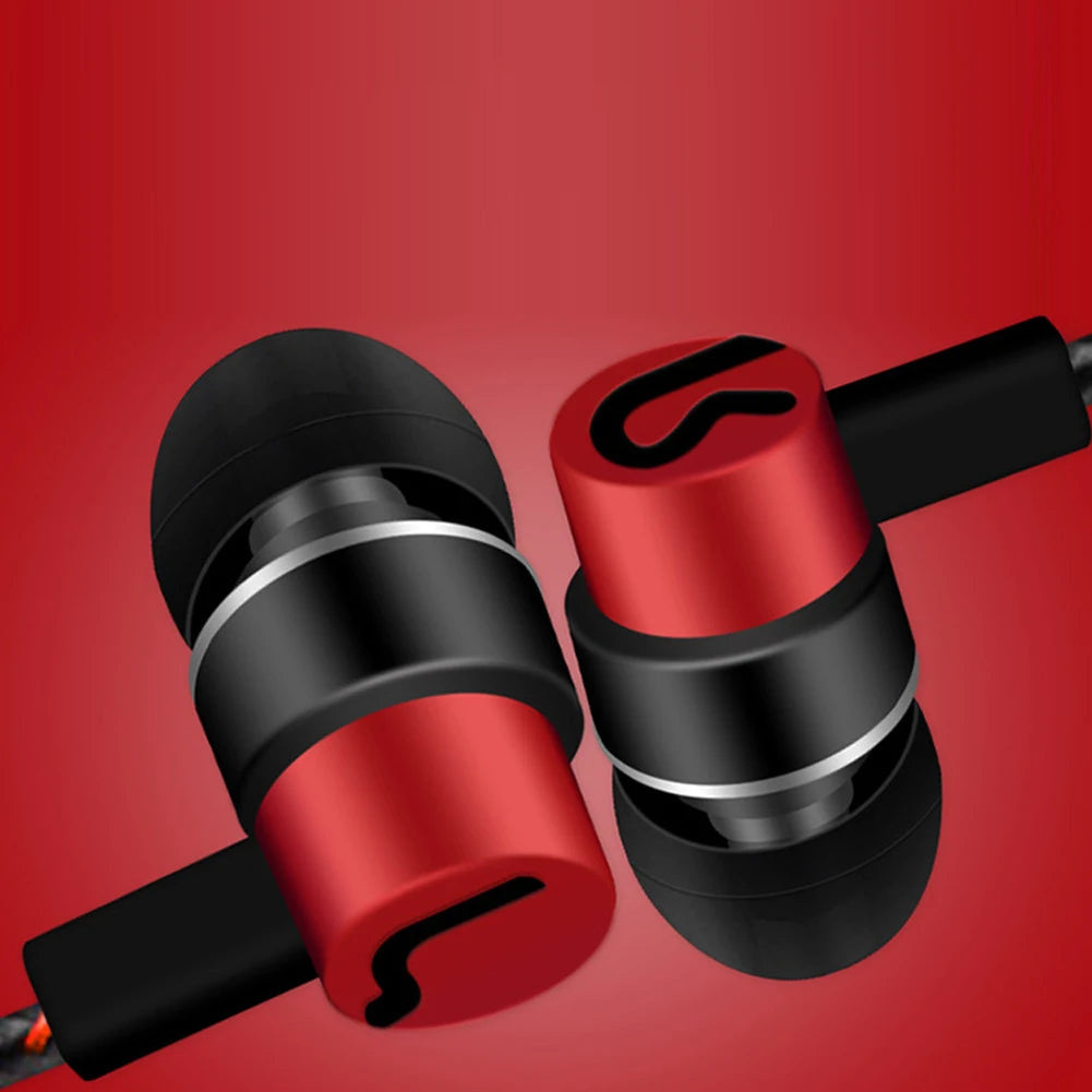 A pair of red and black in-ear wired earbuds shown against a red background.