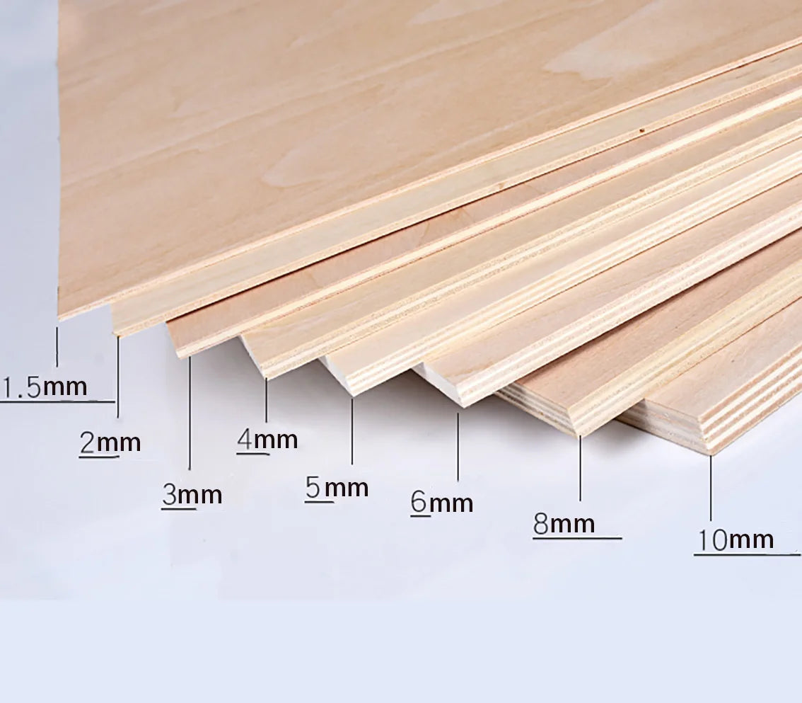 Stack of light wood craft sheets showing various thicknesses and grain patterns for DIY projects