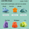 A set of six small animal-shaped toys including a shark, starfish, whale, sea lion, octopus, and turtle for baby recognition.
