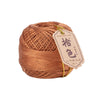 A ball of brown crochet thread used for tatting and embroidery, tied with a gold string.