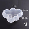 A clear silicone mold with a cloud shape and measurement lines showing dimensions of 4cm, 5.4cm, and 3.5cm.