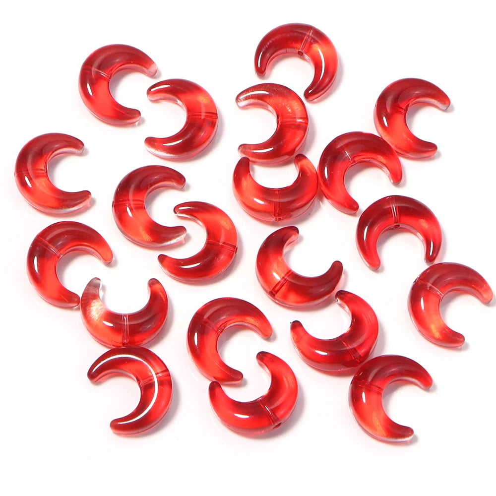 A collection of red glass beads shaped like the moon for DIY jewelry making