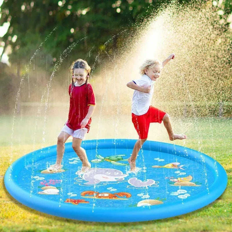 Two young children are playing in a blue inflatable sprinkler play mat outdoors.