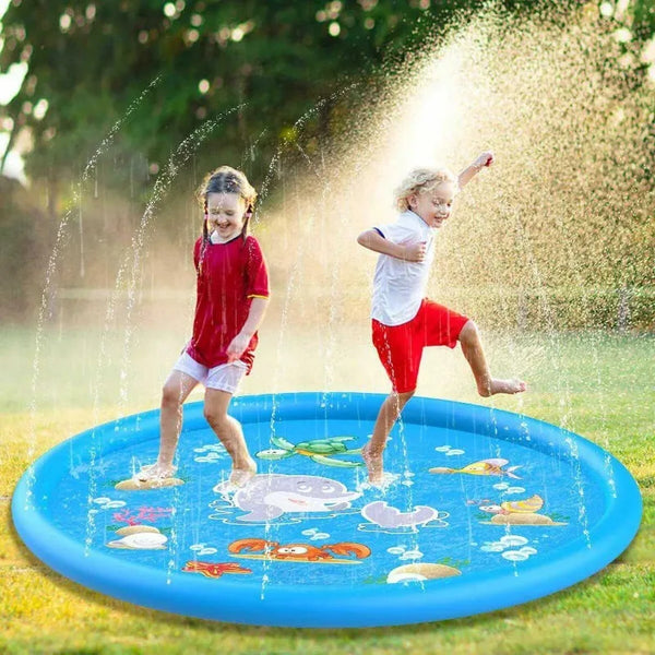 Two young children are playing in a blue inflatable sprinkler play mat outdoors.