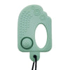 A light green silicone chew necklace with textured grips and a swirl design, attached to a black cord.