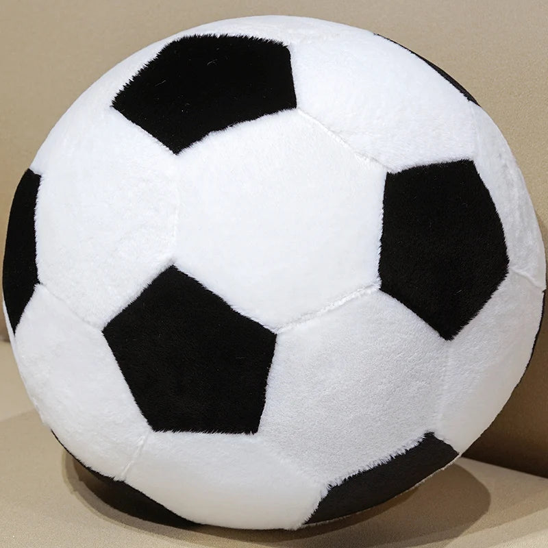 A white and black realistic football plush pillow toy with a soccer ball pattern.