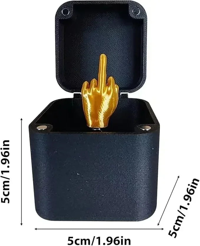 A black pop-up surprise gift box featuring a gold hand gesture on the lid.