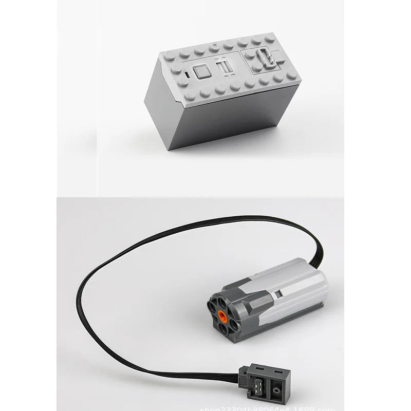 A gray technical power functions motor set for building blocks with a black wire and a small electronic component.