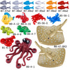 A collection of marine animal building blocks including a shark, octopus, and whale in various colors.