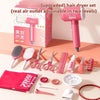 A pink box containing an upgraded hair dryer set with various styling tools like combs, brushes, and rollers.