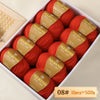 A box of Merino wool yarn balls in a terracotta orange color, packaged for knitting projects.