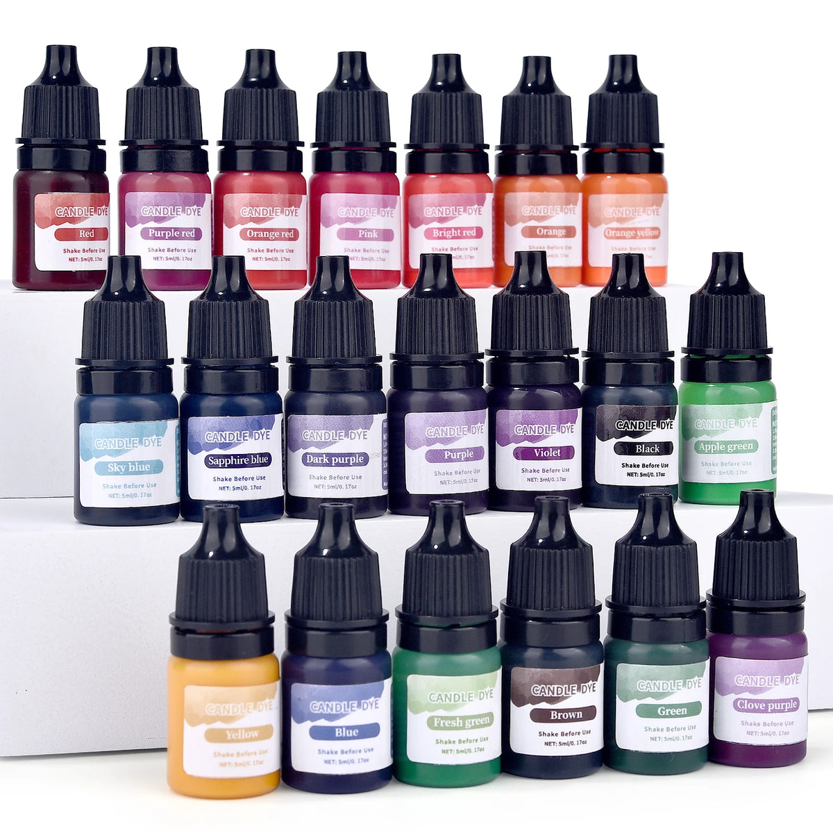 A collection of liquid candle and soap colorants in various shades including red, purple, orange, pink, and green bottles.