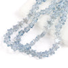A strand of light blue glass star spacer beads for jewelry making
