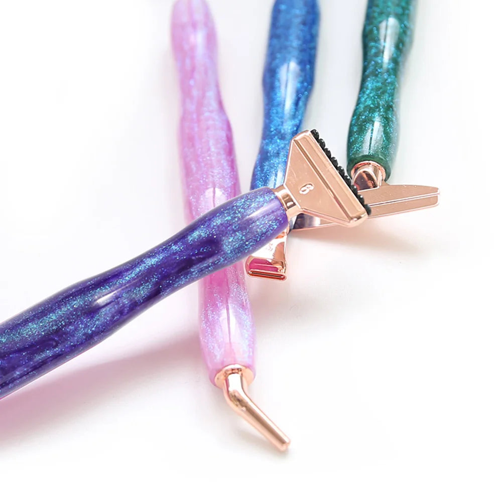 A set of diamond painting pens with interchangeable metal tips in purple, pink, blue, and green colors.