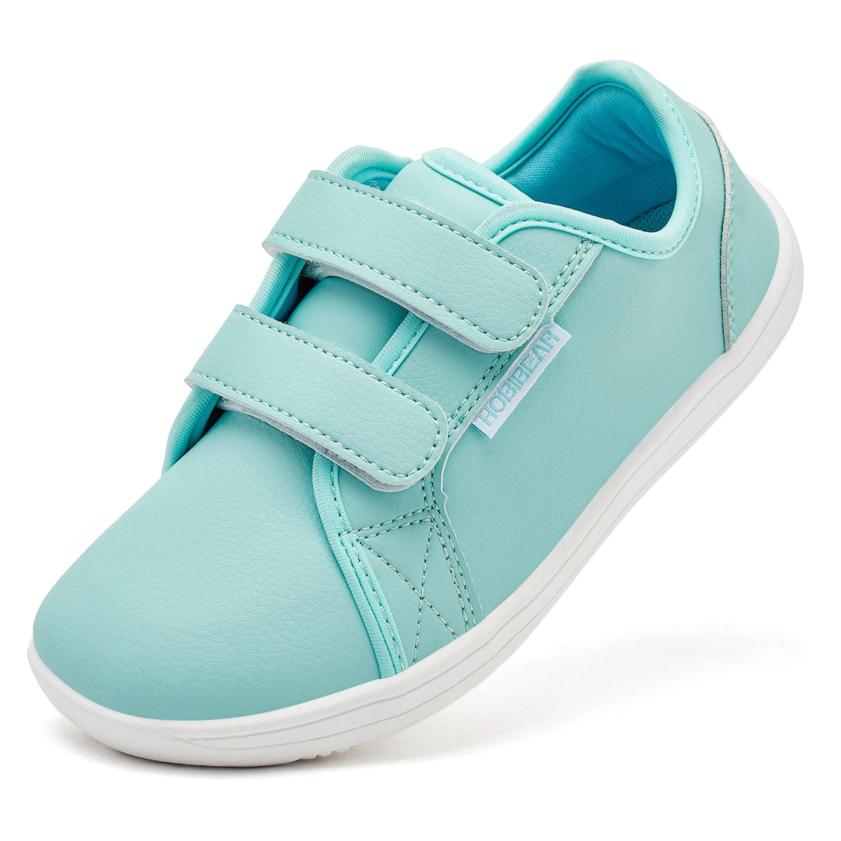 A light mint green kids barefoot sneaker with double hook-and-loop straps shown from the side.