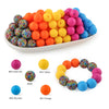 A collection of colorful silicone beads in various shades including pink, yellow, orange, and blue arranged in a line and a c