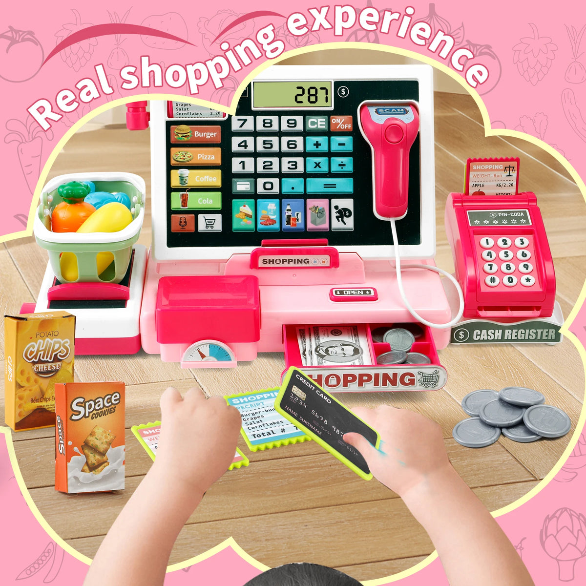 A child is using a pink pretend play cash register with a calculator to simulate a shopping experience.