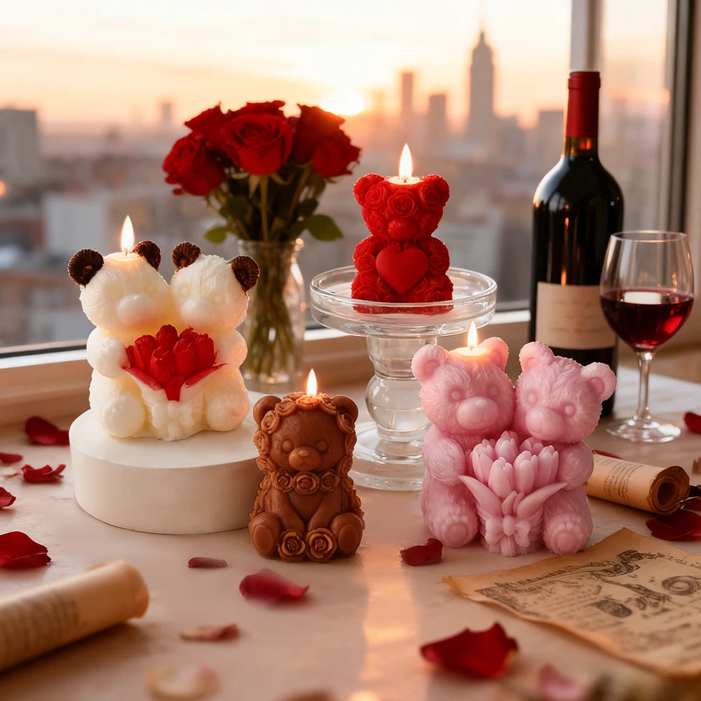 A set of pink and white silicone rose bear candle molds displayed on a wooden surface with red rose petals.
