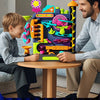 A boy and an adult play with a multi-layer rolling ball track adventure toy featuring colorful components.