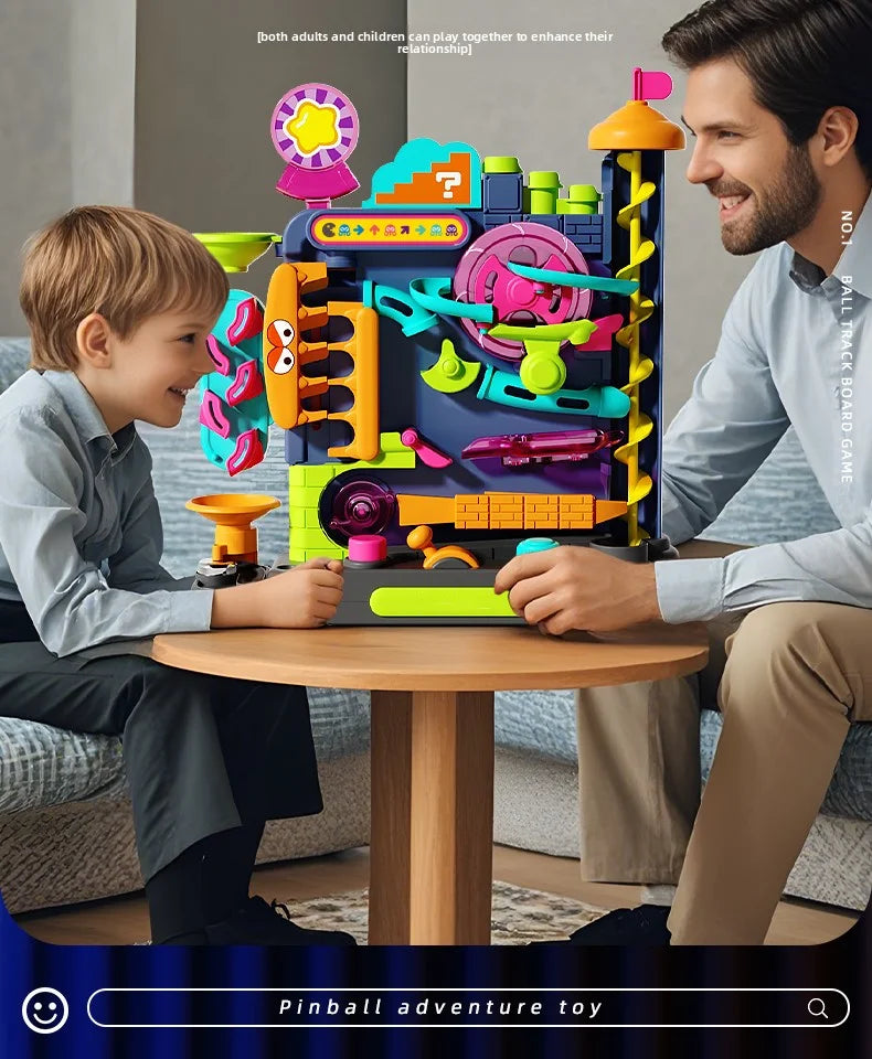 A boy and an adult play with a multi-layer rolling ball track adventure toy featuring colorful components.