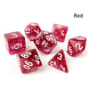 A set of seven red polyhedral acrylic dice showing various numbers and dots.
