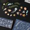 A collection of silicone nail art molds featuring various sea creatures like starfish, shells, and fish.