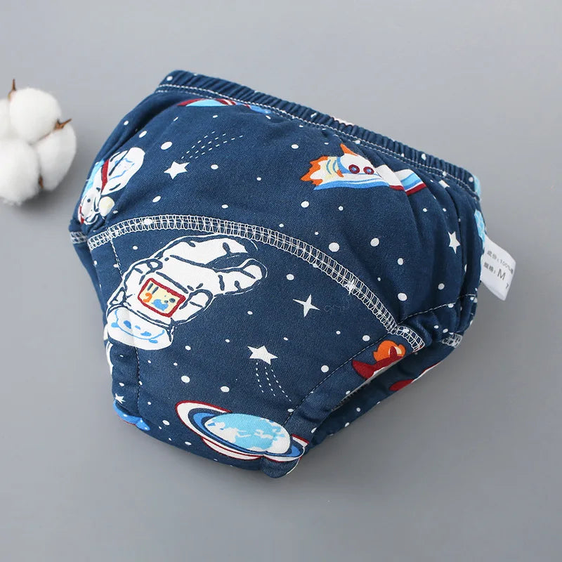 Pantalones de entrenamiento de tela azul marino para bebés con temática espacial de estrellas y planetas