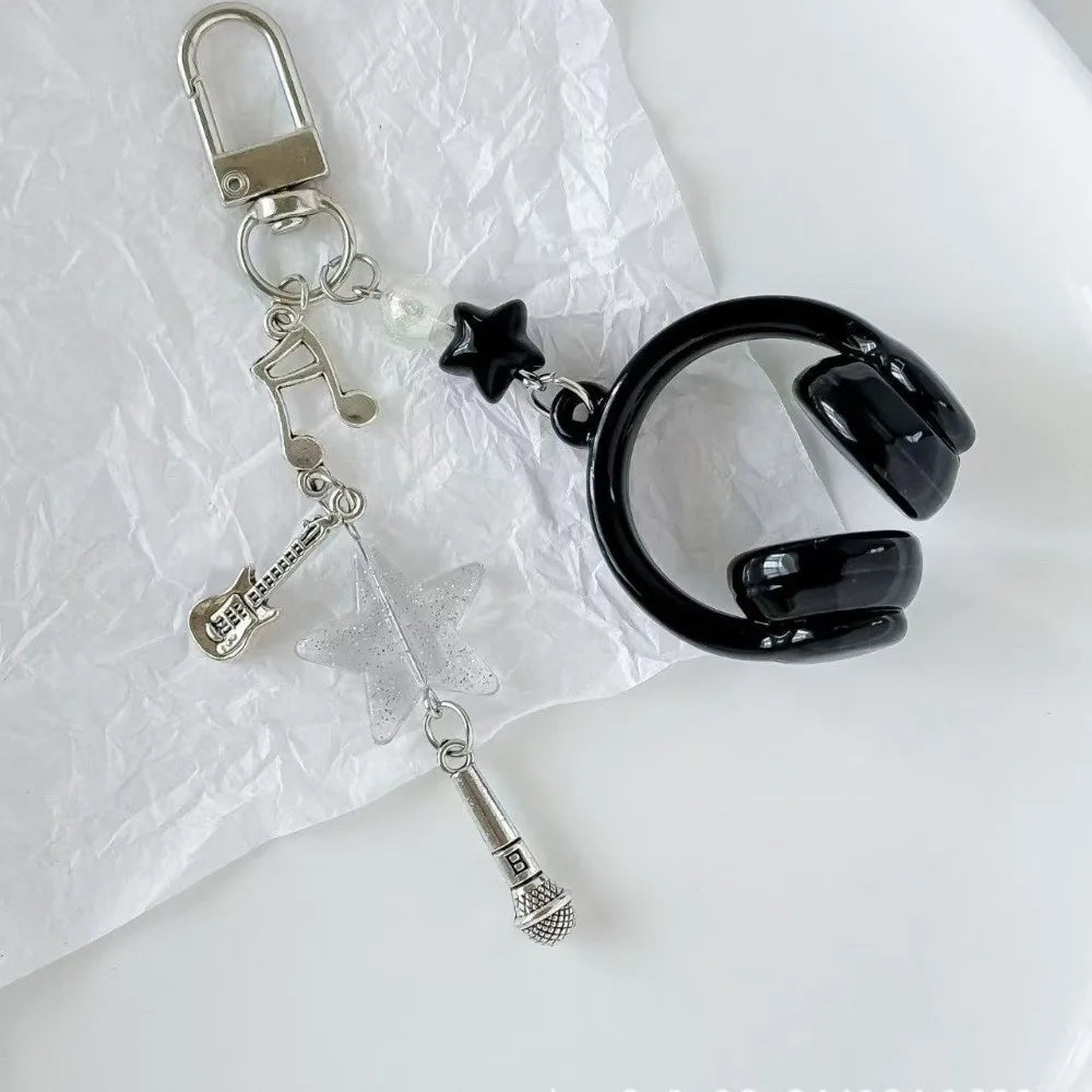 Silver beaded wing cross phone lanyard keychain with a black charm