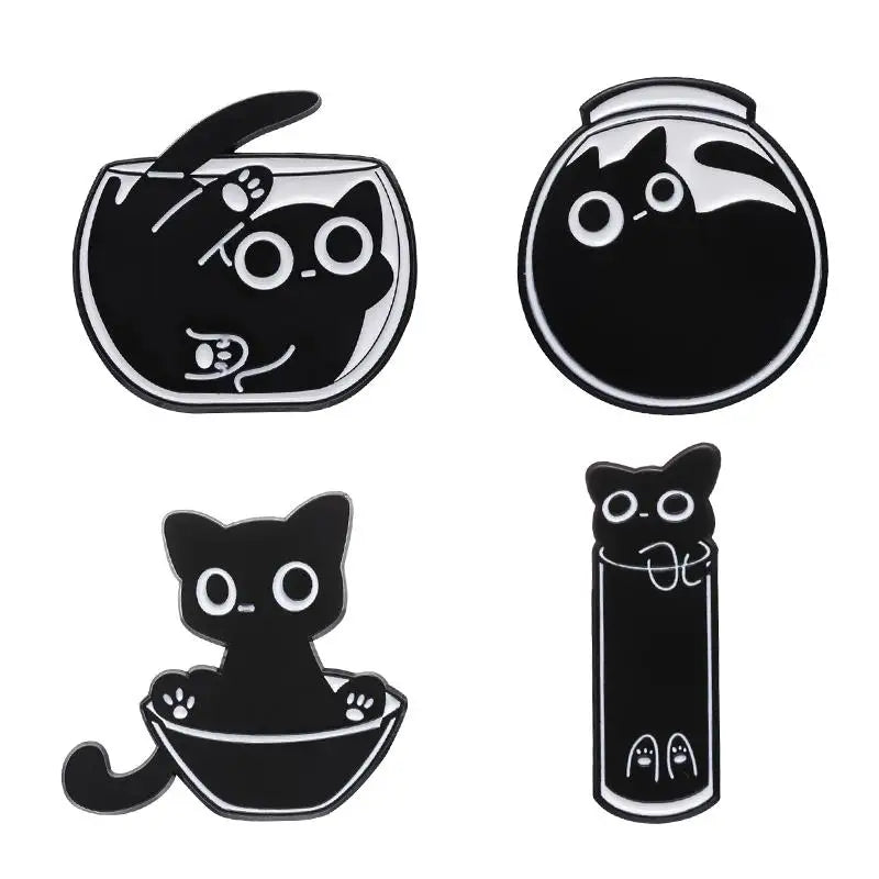 A set of four black cat enamel pins featuring different styles and designs.