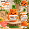 Handmade crochet orange doll with a squeeze the day motivational card and a delicate leaf