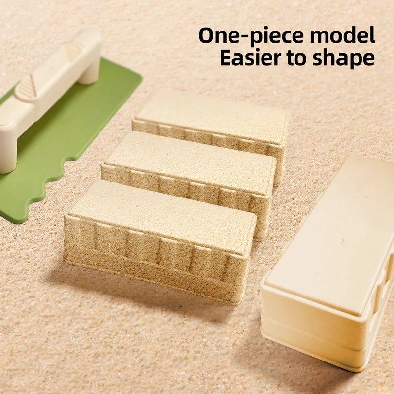 One-piece model sand and snow building play set with shovel and brick molds shown on a sandy surface.