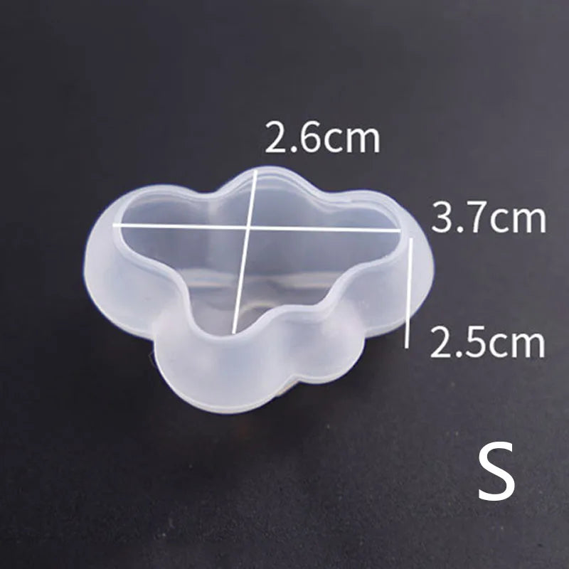 A clear silicone mold with a cloud shape and measurement lines showing dimensions of 2.6cm, 3.7cm, and 2.5cm.