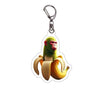 Acrylic keychain featuring a green monkey holding a banana, designed as a brainrot meme.