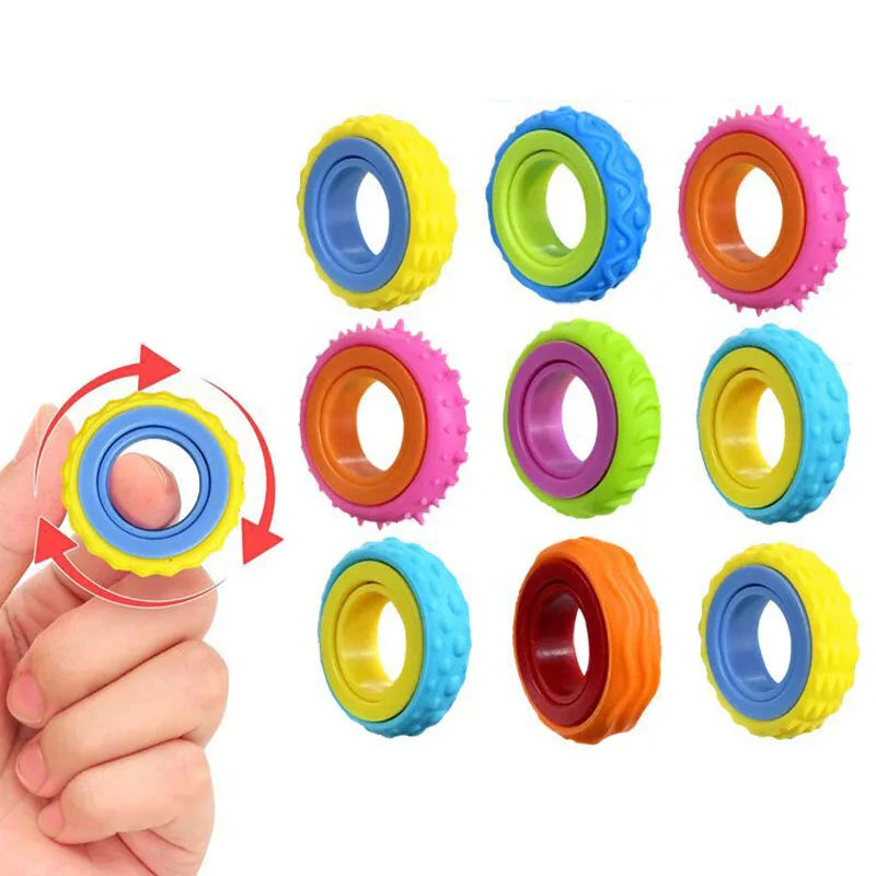 A hand holds a set of colorful sensory fidget rings for stress relief and focus.
