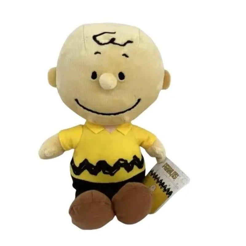 A yellow Peanuts Snoopy plush toy doll with black facial features and clothing.