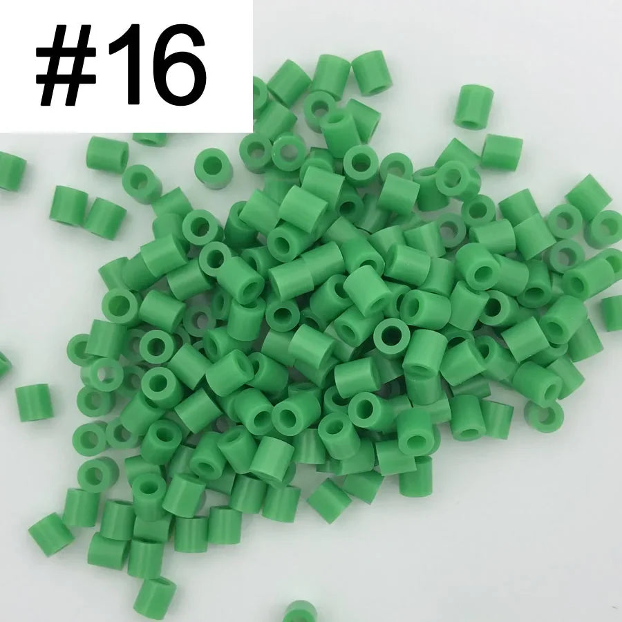 A pile of 1000 green DIY fuse beads, 5mm in size, for creative craft projects.