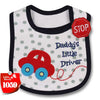 A white baby feeding bib with a dark trim and a red cartoon car design.